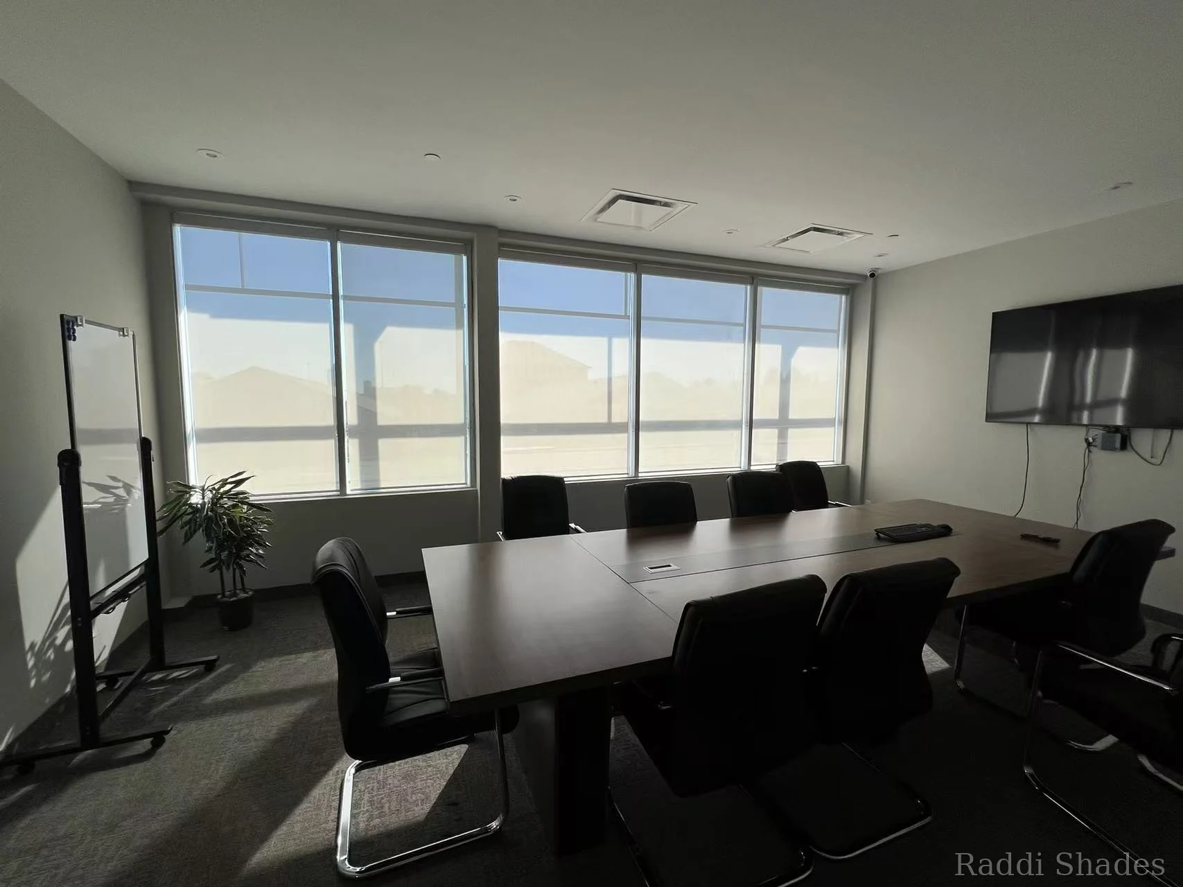 Boardroom roller shade installation